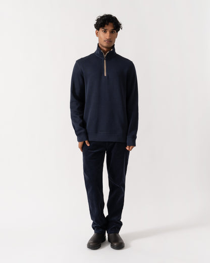 Man wearing GANT Mens Sacker Rib Half Zip Sweatshirt - 433 Evening Blue