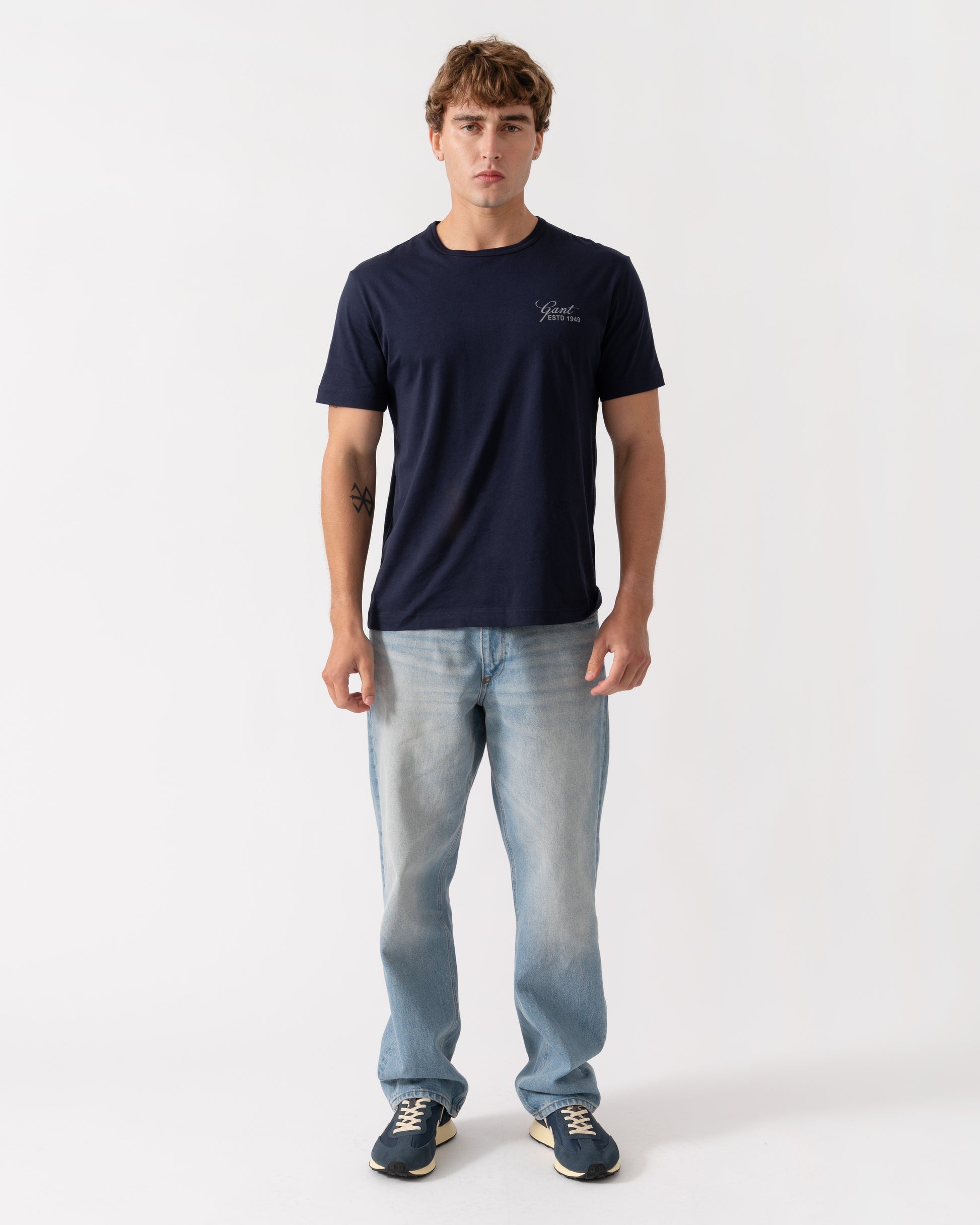 Outfit shot of GANT Mens Short Sleeve Small Graphic Logo T-Shirt - 433 Evening Blue