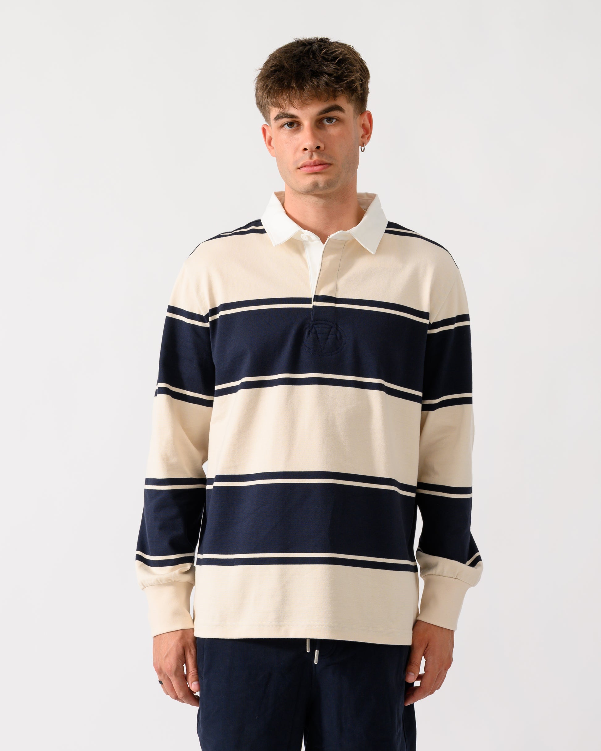 model wearing a GANT Mens Striped Rugger in 433 Evening Blue