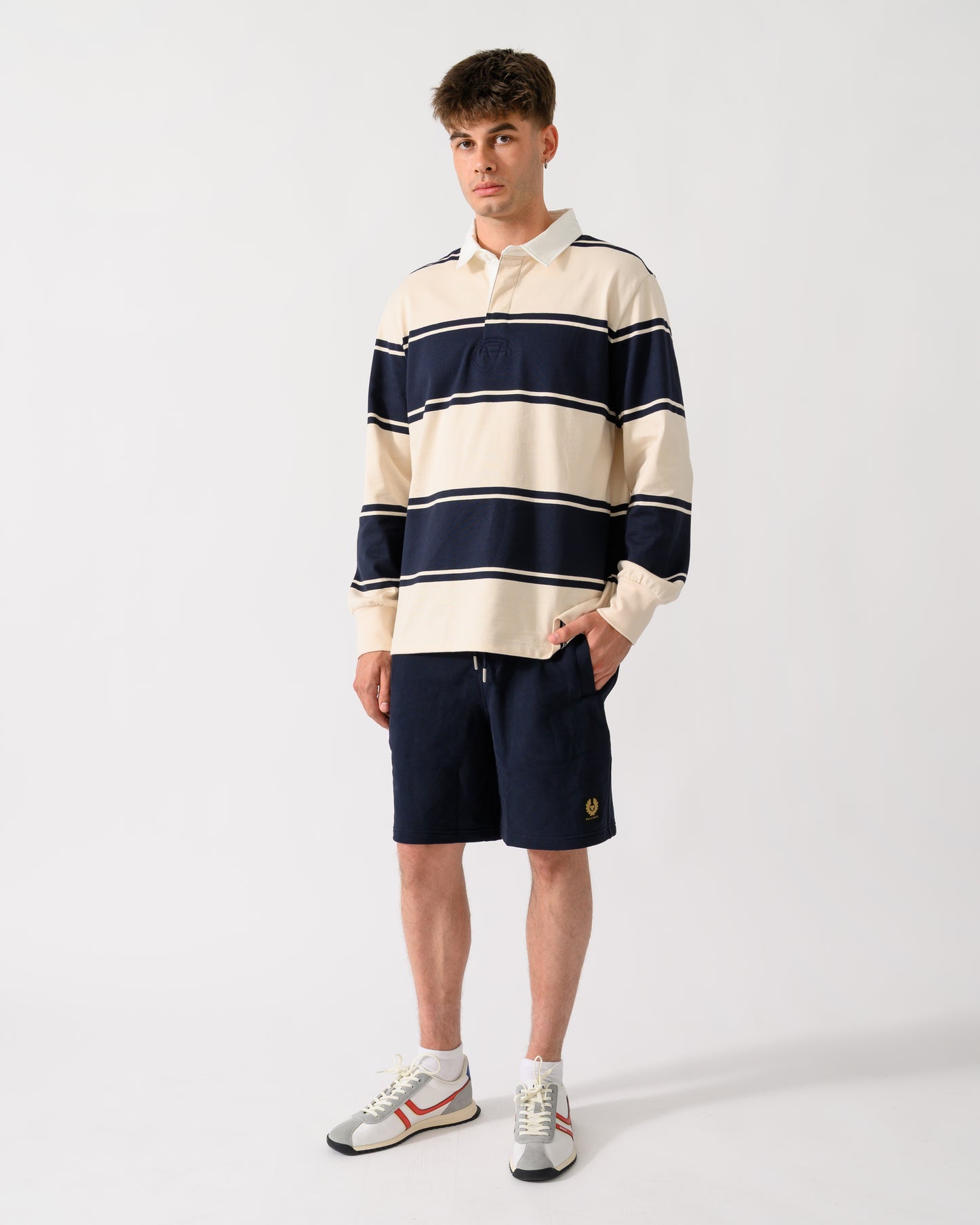 full length shot of a model wearing a GANT Mens Striped Rugger in 433 Evening Blue
