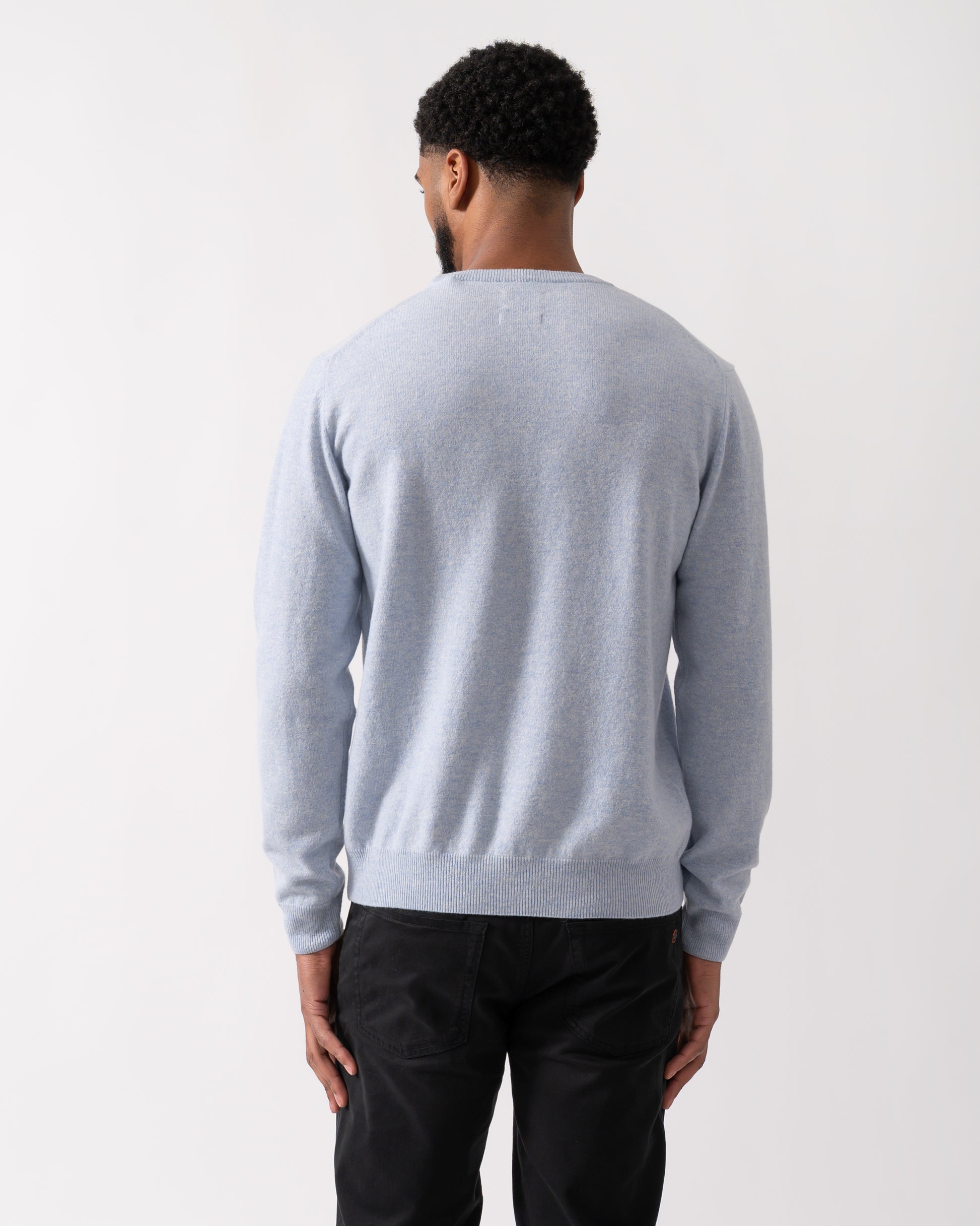 back shot of a model wearing a GANT Mens Superfine Lambswool Crew Neck Jumper in Ice Blue Melange