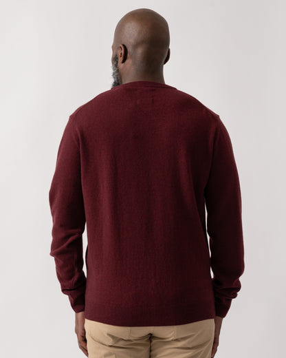 back shot of a Model wearing a GANT Mens Superfine Lambswool Crew Neck Jumper in Bordeaux Melange