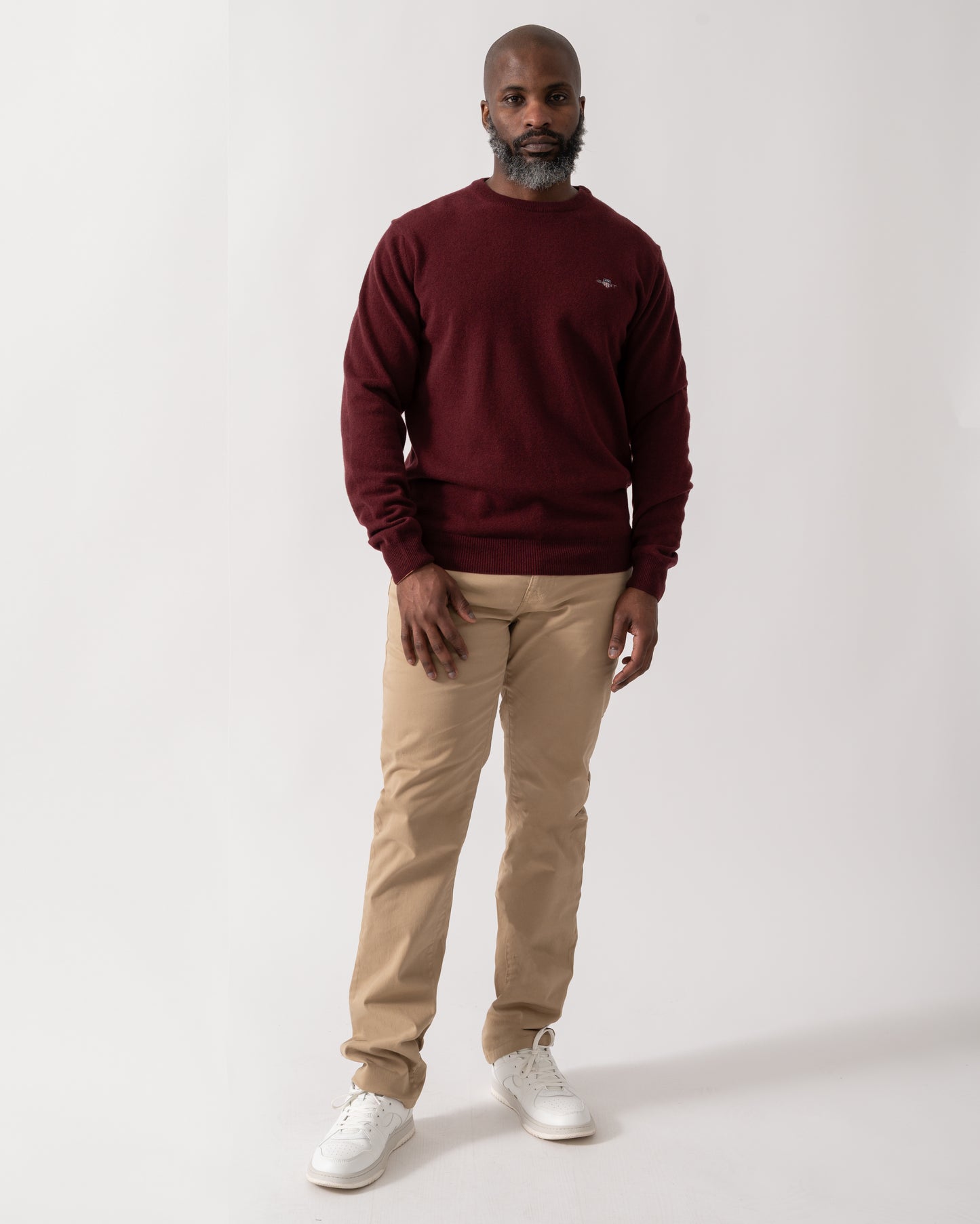 Full length shot of a Model wearing a GANT Mens Superfine Lambswool Crew Neck Jumper in Bordeaux Melange