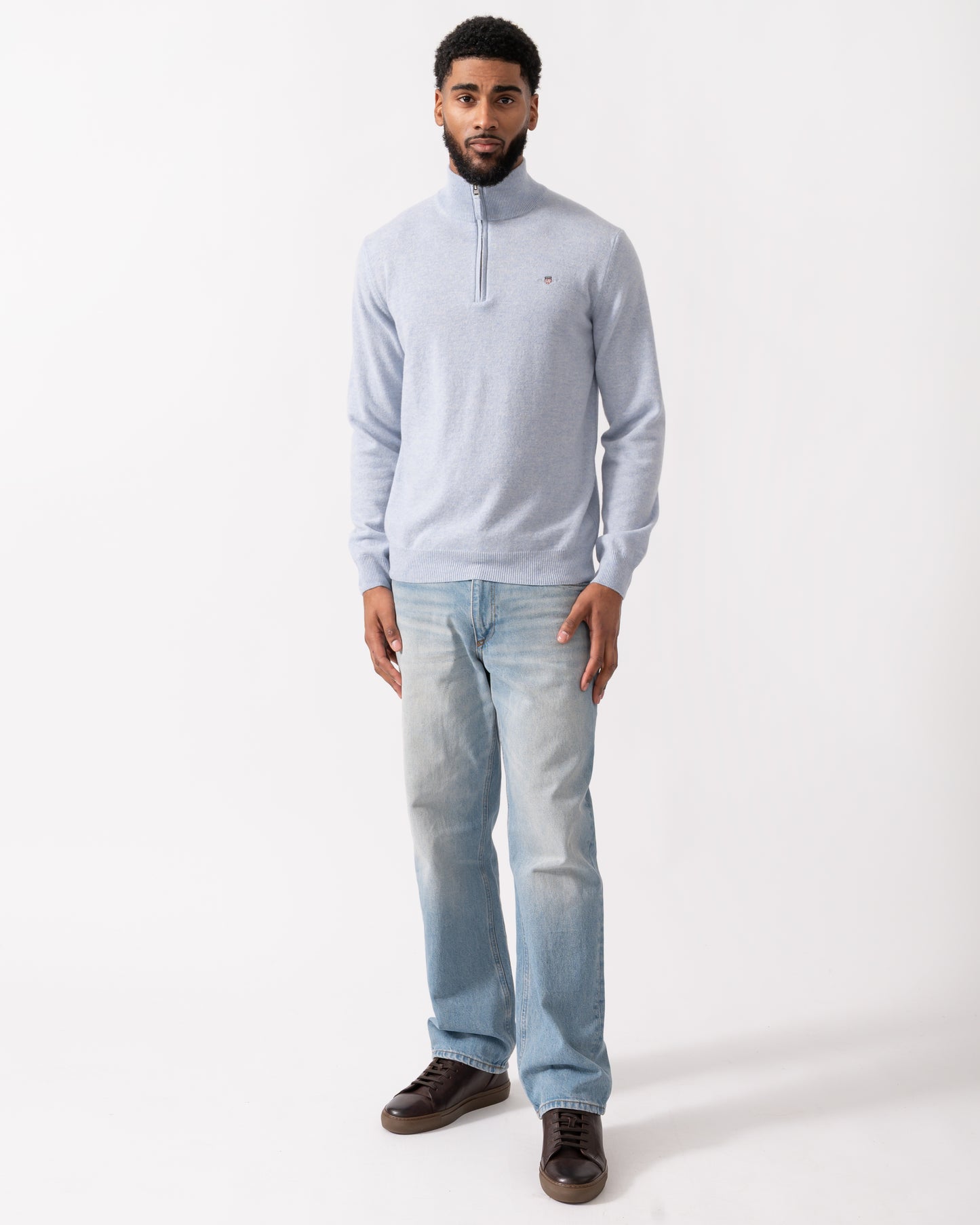 full length of a model wearing a GANT Mens Superfine Lambswool Half Zip Cardigan in Ice Blue Melange