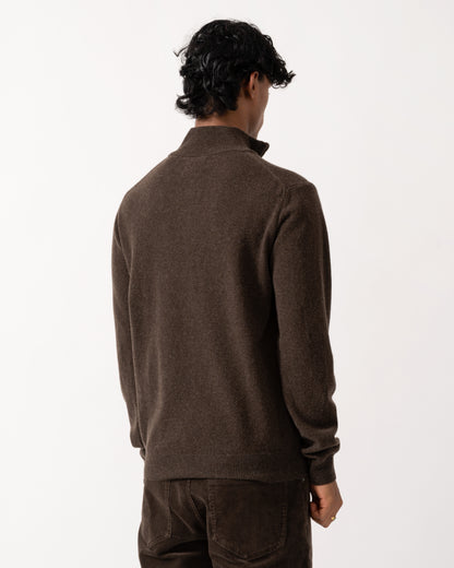 studio photograph showing the back of a model wearing a GANT Mens Superfine Lambswool Half Zip Sweater in 280 Dark Brown Melange