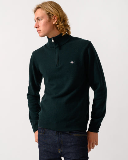 model wearing a GANT Mens Superfine Lambswool Half Zip Sweater in 374 Tartan Green