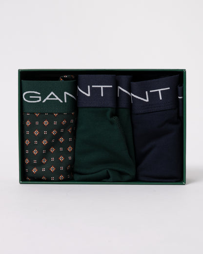 studio photograph showing a inside the packaging of GANT Mens Trunk 3-Pack Gift Box in 374 Tartan Green