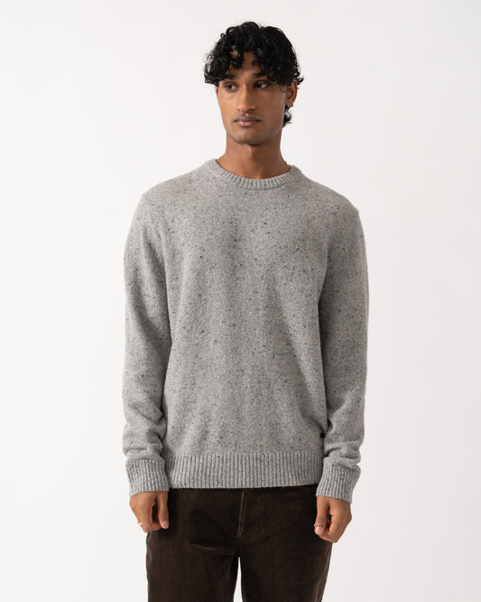 Studio photograph of a model wearing a GANT Mens Wool Blend Neps Crew Neck Sweater in 93 Grey Melange