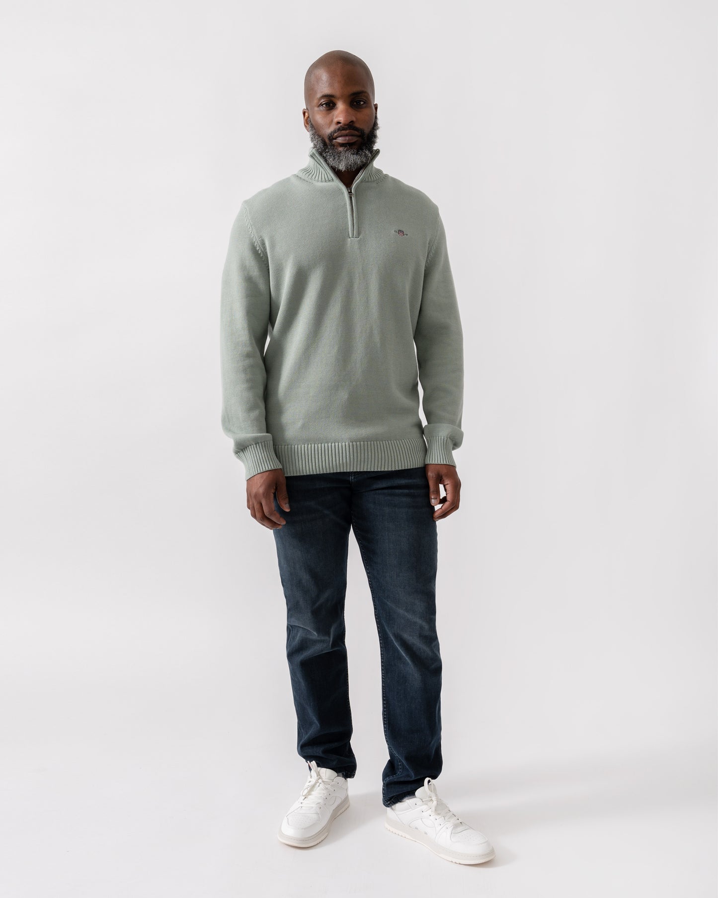 Model wearing GANT Mens Casual Cotton Half Zip Jumper in 10 Ceramic Grey - Full Length