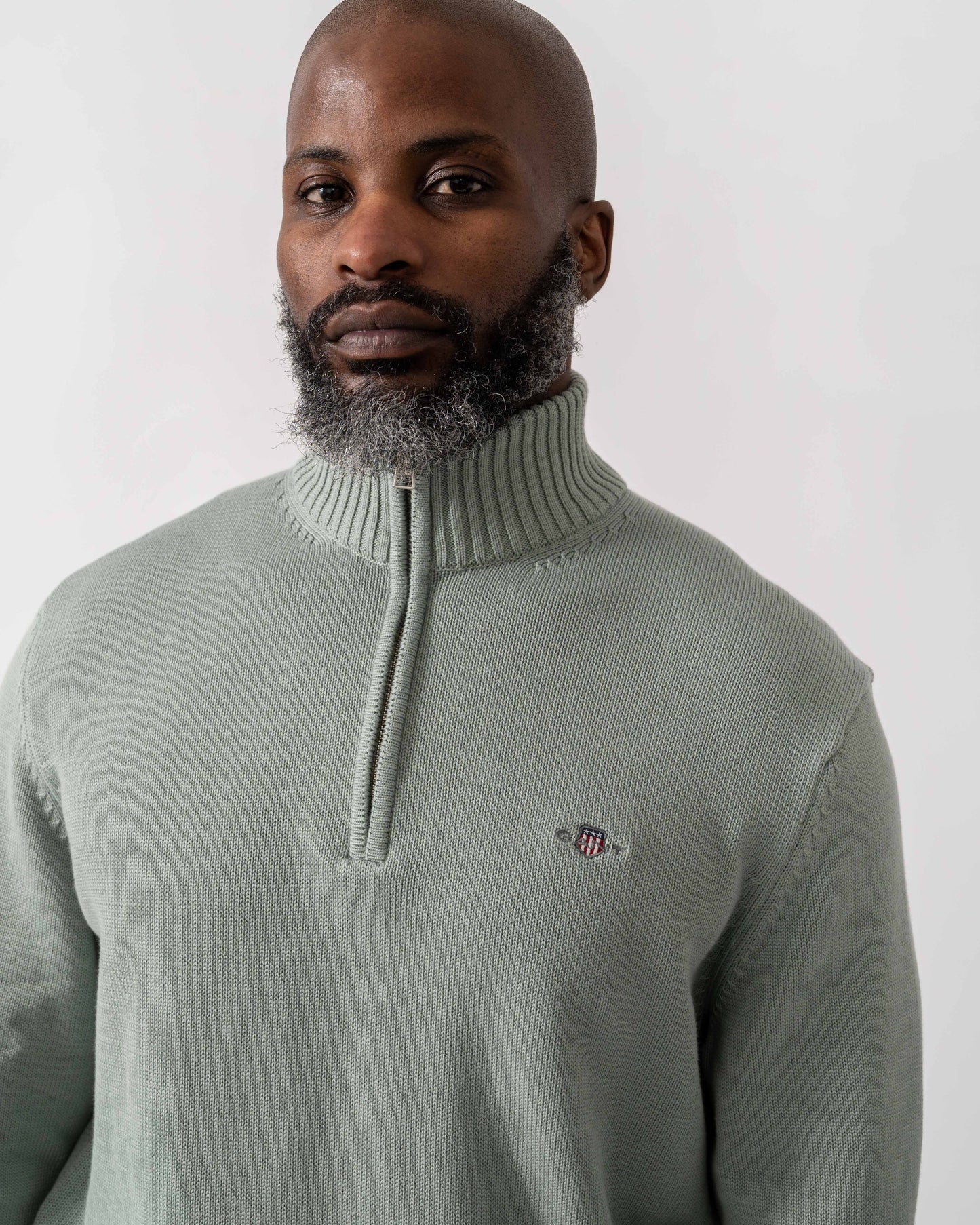 Model wearing GANT Mens Casual Cotton Half Zip Jumper in 10 Ceramic Grey - Detail