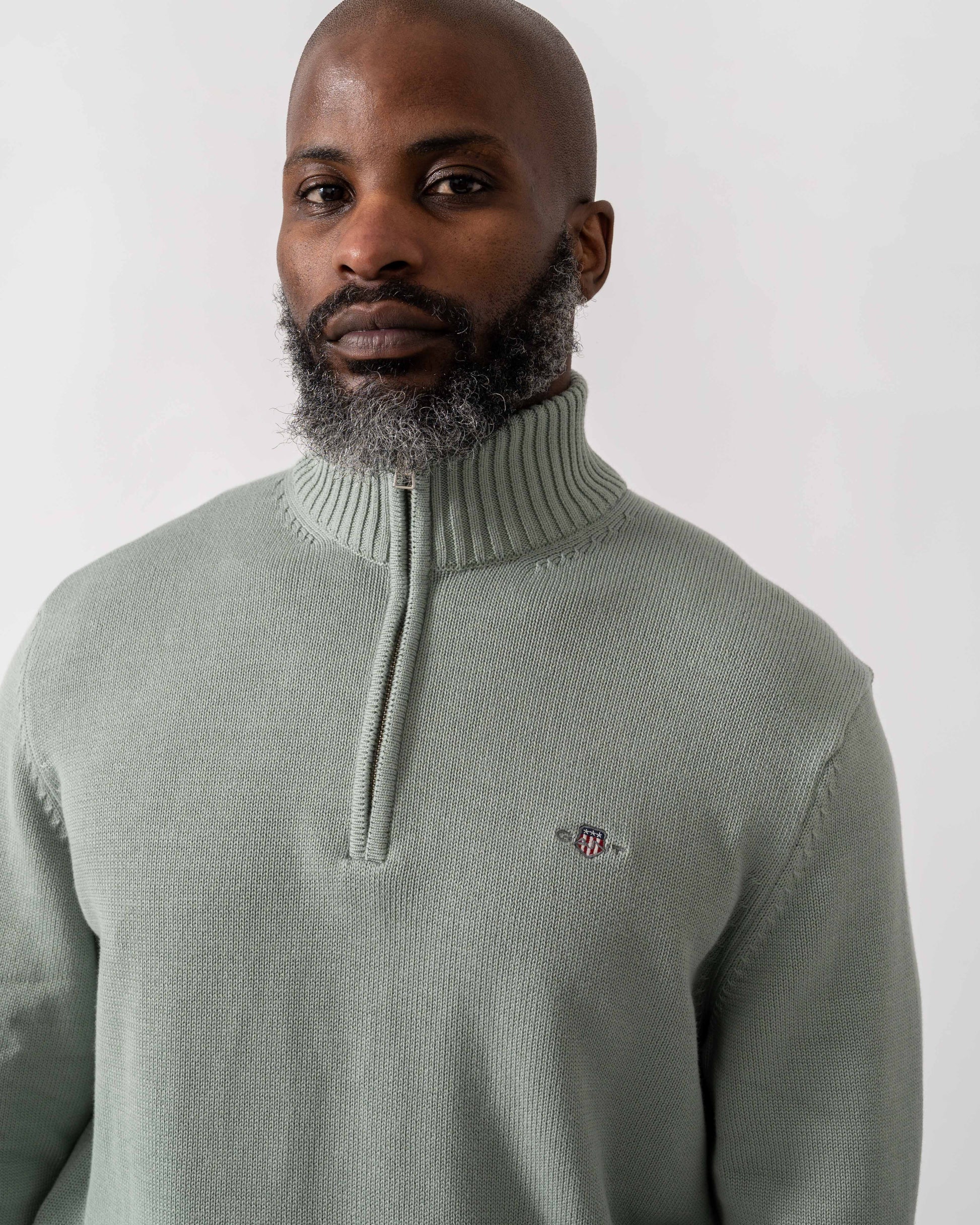 Model wearing GANT Mens Casual Cotton Half Zip Jumper in 10 Ceramic Grey - Detail