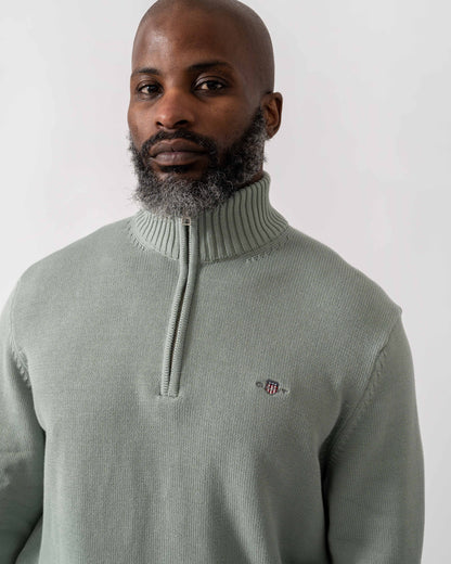 Model wearing GANT Mens Casual Cotton Half Zip Jumper in 10 Ceramic Grey - Detail