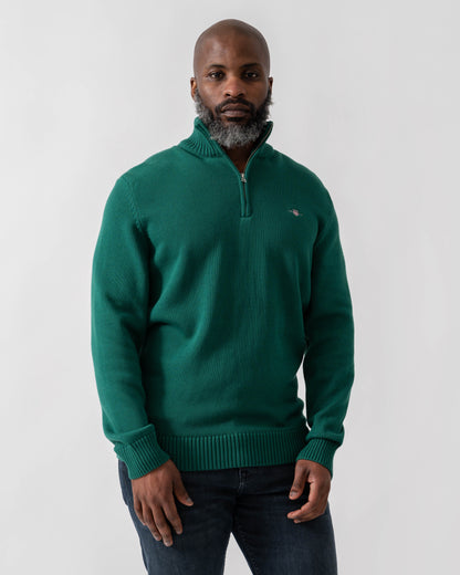 Model wearing GANT Mens Casual Cotton Half Zip Jumper in 373 Deep Forest Green - Main