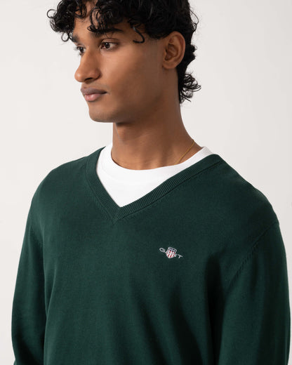 Close up of the GANT Mens Classic Cotton Shield Logo V-Neck Jumper - 374 Tartan Green