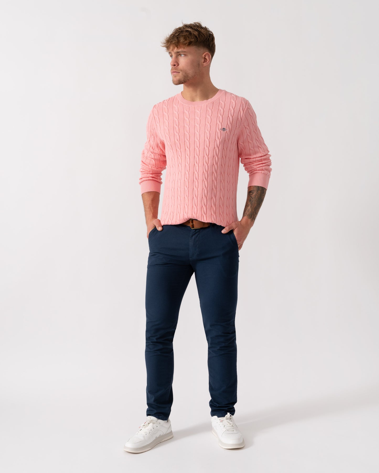 Man wearing GANT Mens Cotton Cable Knit Crew Neck Jumper in 666 Washed Pink - Full Length