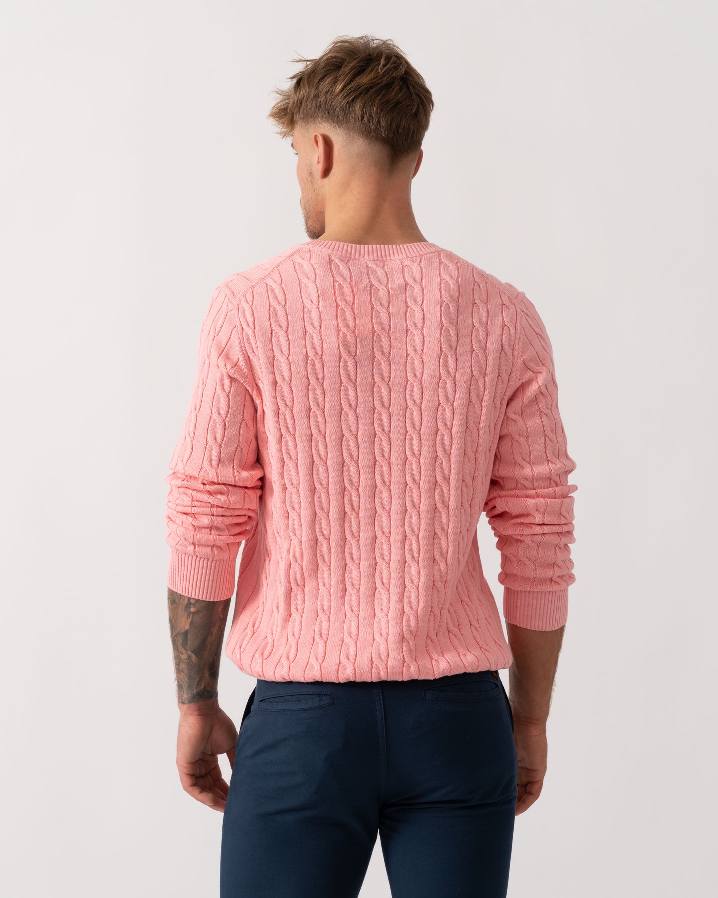 Man wearing GANT Mens Cotton Cable Knit Crew Neck Jumper in 666 Washed Pink - Back