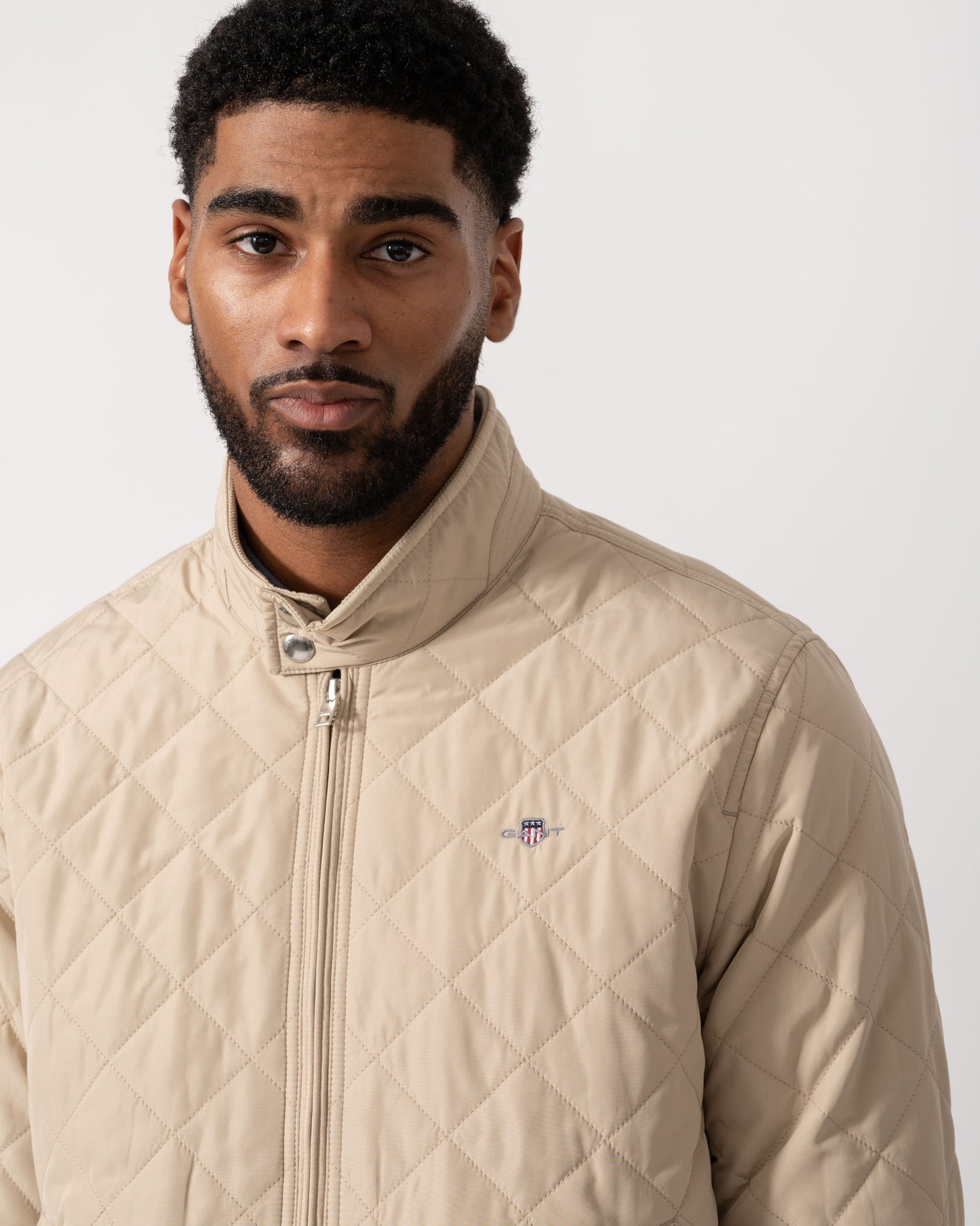 Model wearing GANT Mens Quilted Windcheater Jacket in 200 Oat Beige - detail