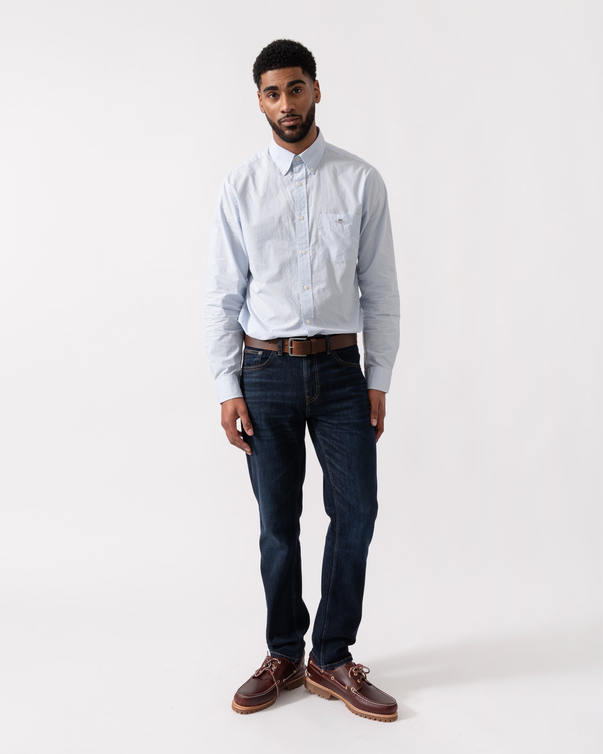 Model wearing GANT Mens Regular Fit Classic Poplin Gingham Shirt in 455 Light Blue - full length