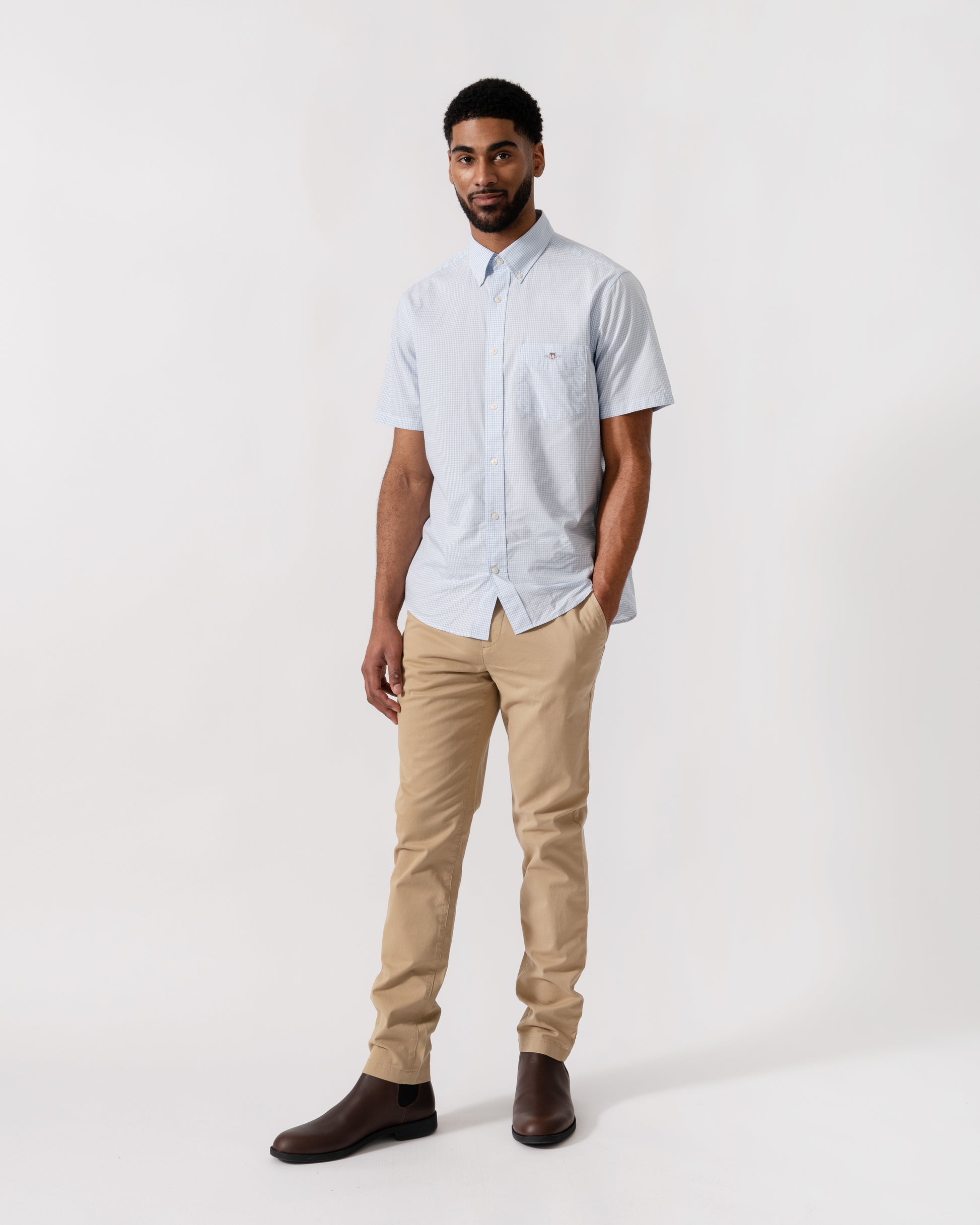 Model wearing a GANT Mens Regular Fit Classic Poplin Gingham Short Sleeve Shirt in 455 Light Blue - full length