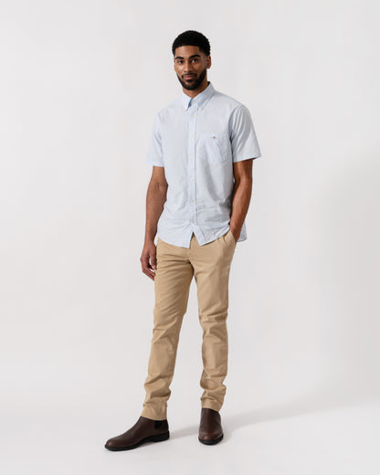 Model wearing a GANT Mens Regular Fit Classic Poplin Gingham Short Sleeve Shirt in 455 Light Blue - full length