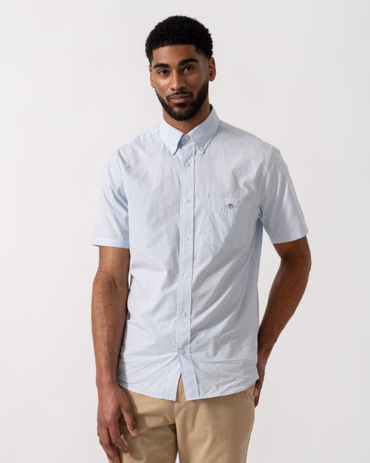 Model wearing a GANT Mens Regular Fit Classic Poplin Gingham Short Sleeve Shirt in 455 Light Blue - Main