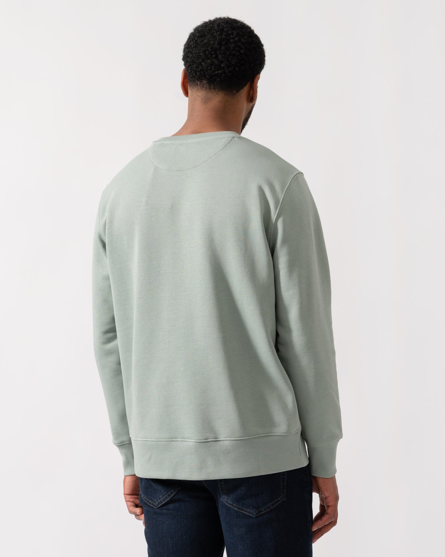 Model wearing GANT Mens Regular Fit Shield Logo Crew Neck Sweatshirt -in 10 Ceramic Grey - back