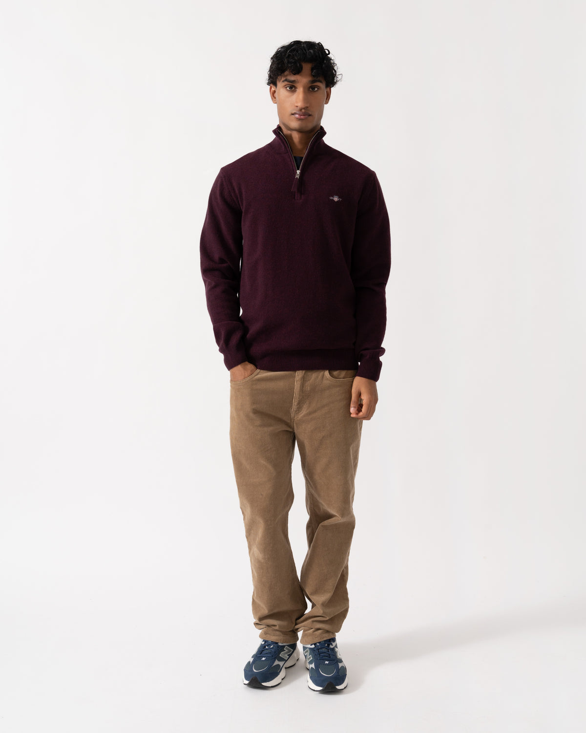 Man wearing the GANT Mens Superfine Lambswool Half Zip Sweater - 667 Darkened Wine
