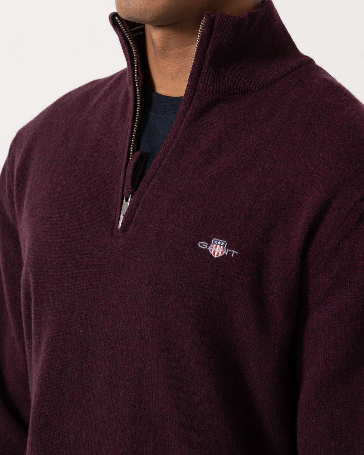 Close up of the GANT Mens Superfine Lambswool Half Zip Sweater - 667 Darkened Wine