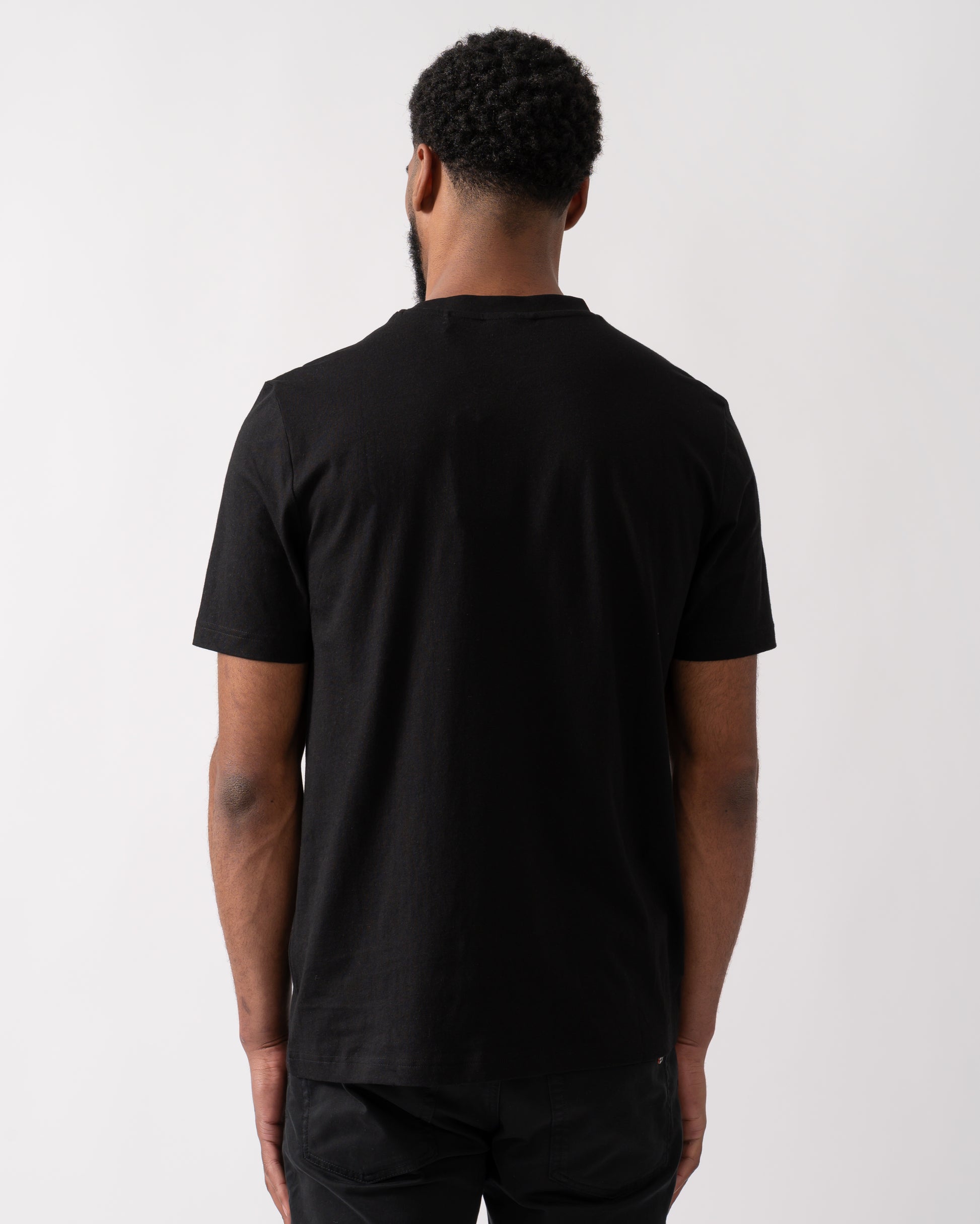 back shot of a model wearing a HUGO Danotie Mens Red Label Logo T-Shirt in Black
