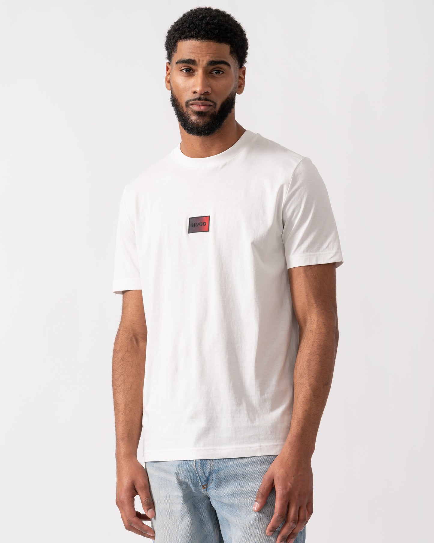 model wearing a HUGO Danotie Mens Red Label Logo T-Shirt in natural white