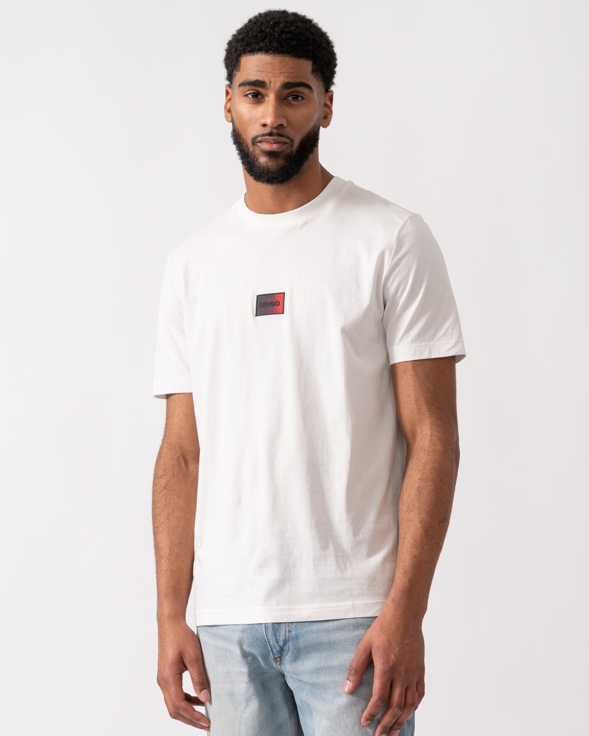 model wearing a HUGO Danotie Mens Red Label Logo T-Shirt in natural white