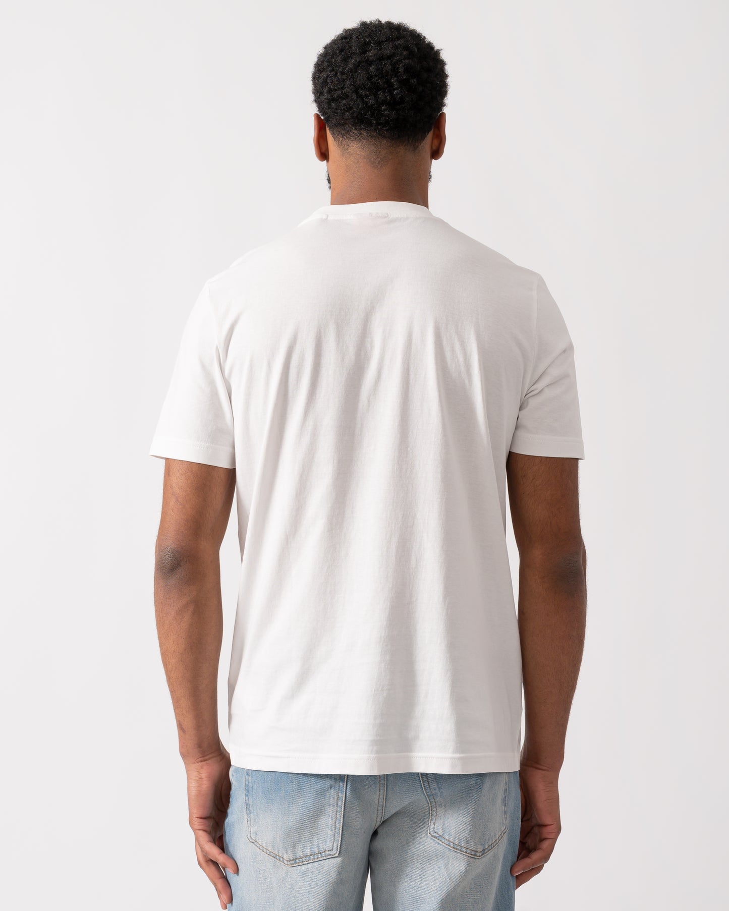 back of a model wearing a HUGO Danotie Mens Red Label Logo T-Shirt in natural white