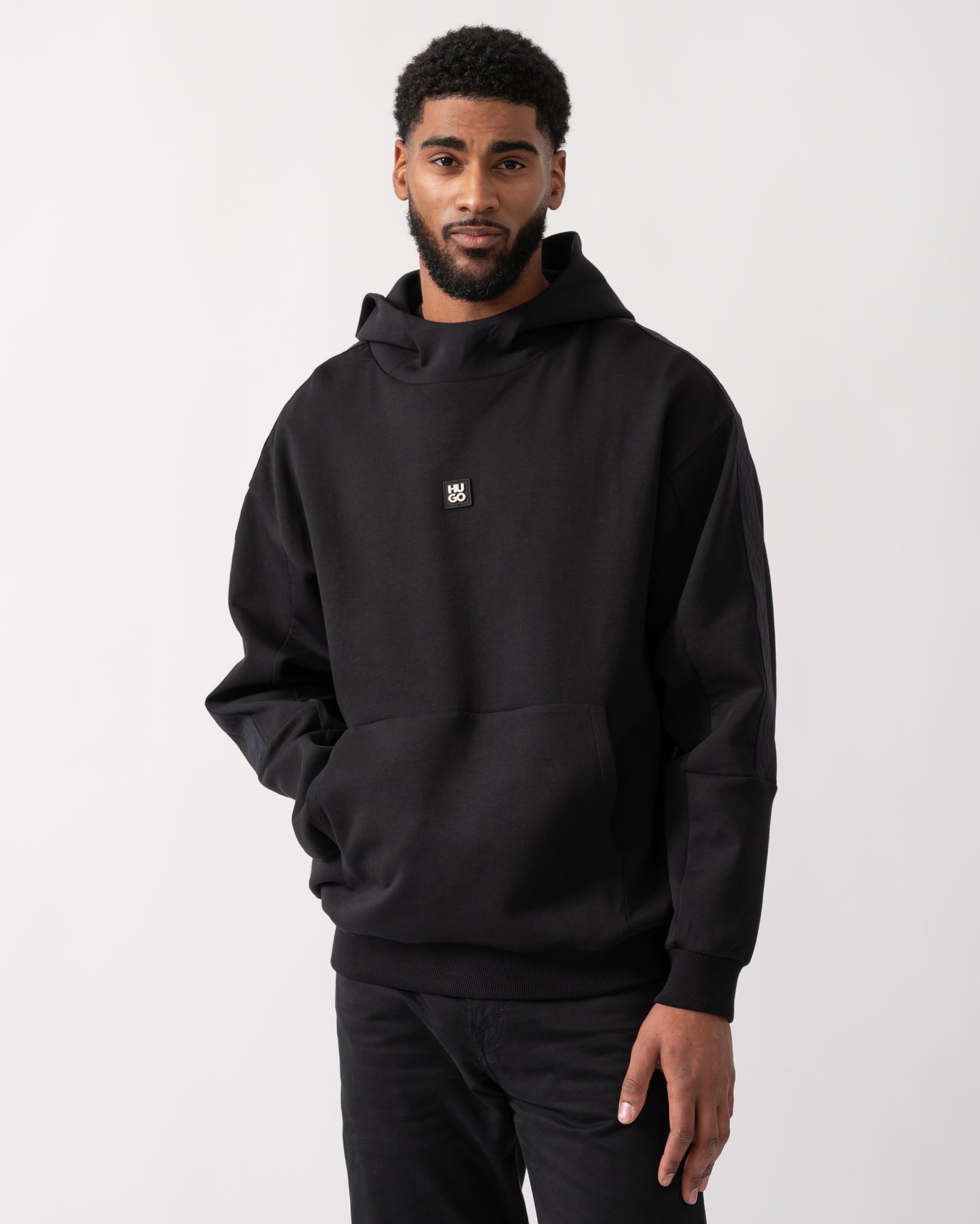 model wearing a HUGO Danovohood Mens Hoodie in Black