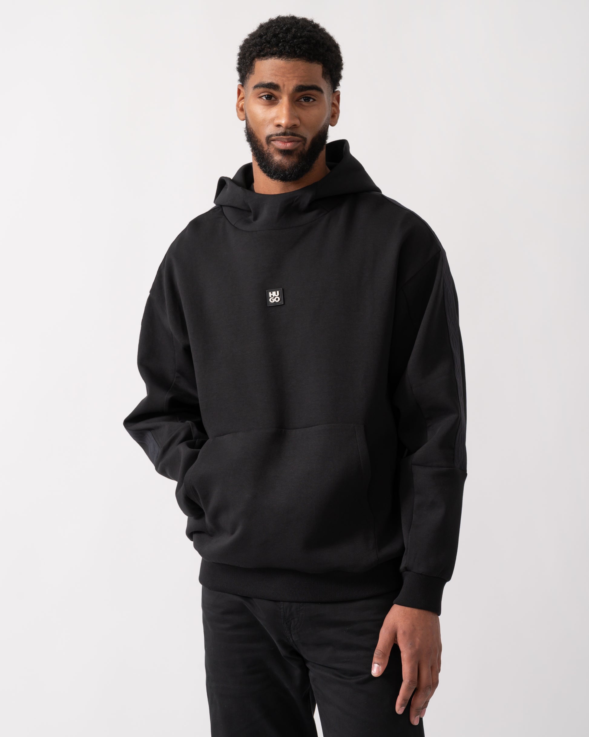 model wearing a HUGO Danovohood Mens Hoodie in Black