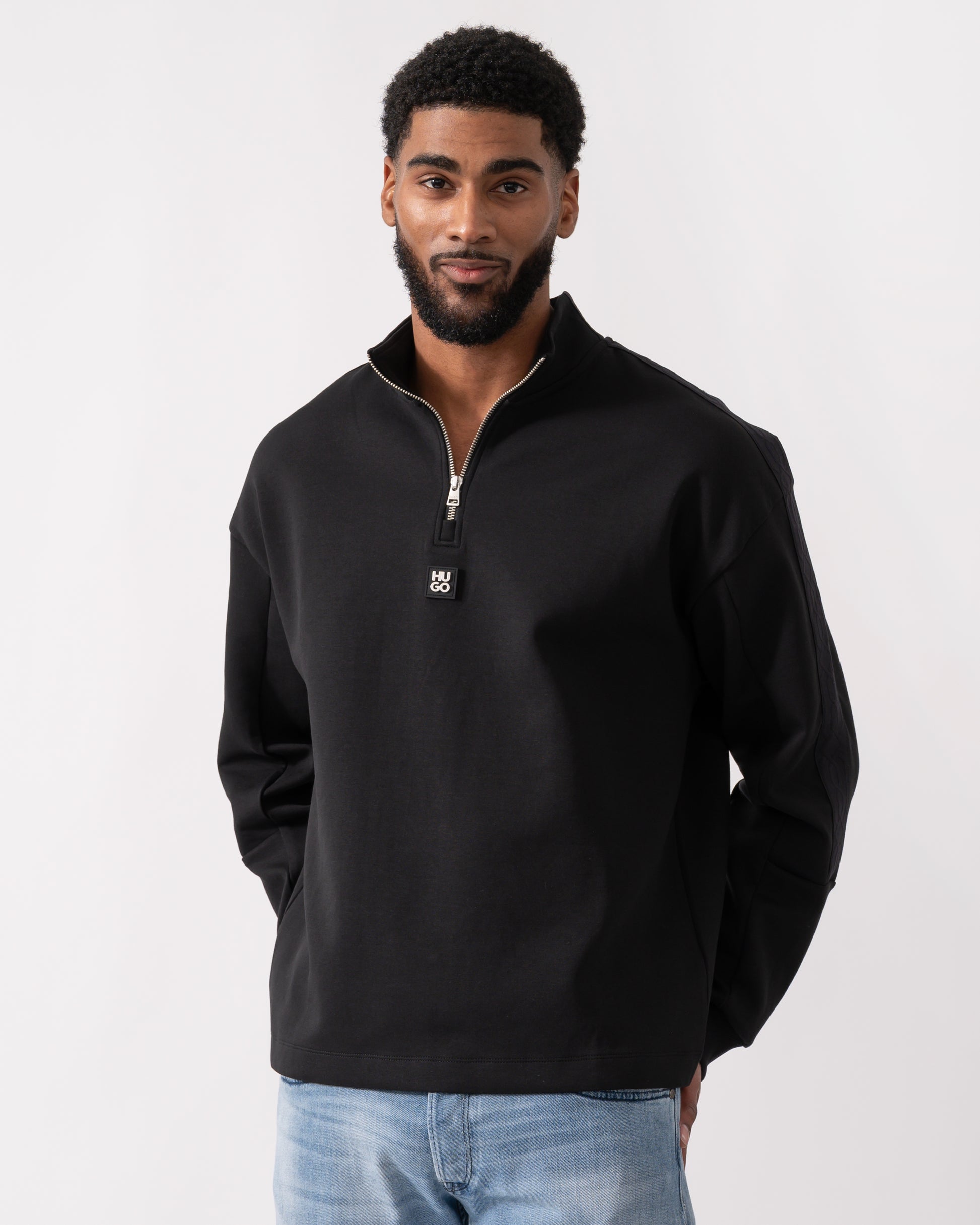 model wearing a HUGO Danovotop Mens Sweatshirt in Black