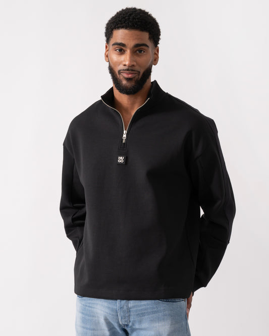 model wearing a HUGO Danovotop Mens Sweatshirt in Black