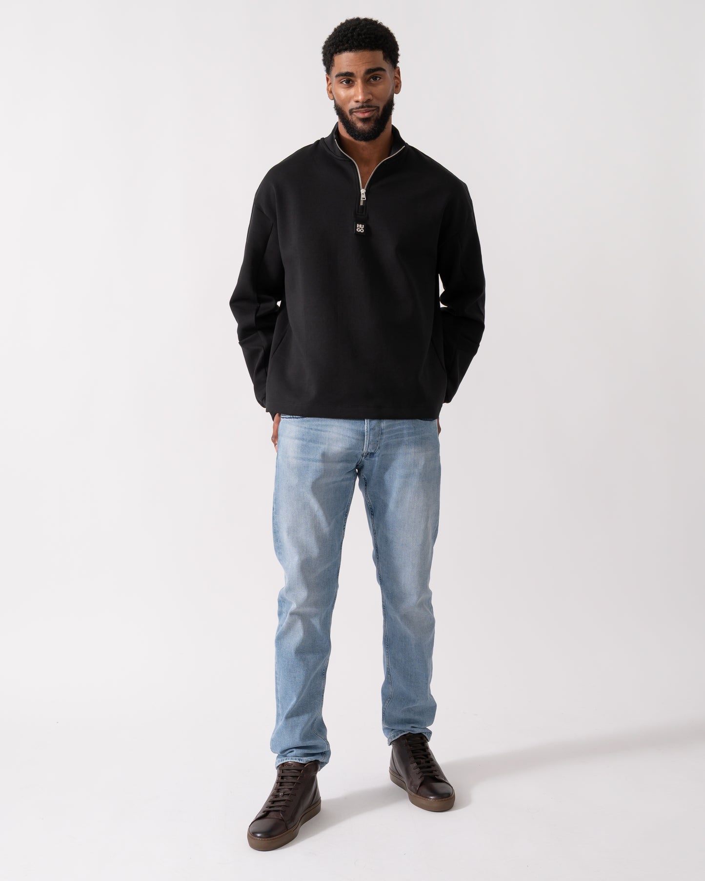 full length shot of a model wearing a HUGO Danovotop Mens Sweatshirt in Black