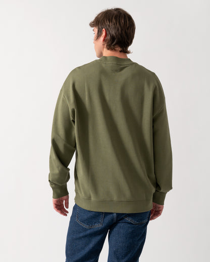 back shot of a model wearing a HUGO Dapocrew Mens Crew Neck Sweatshirt in Open Green 388