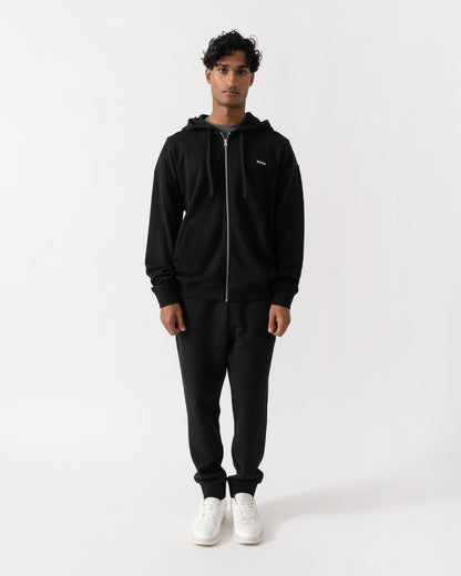 Man wearing HUGO Dapozip Mens Cotton-terry zip-up hoodie with logo print - Black 001