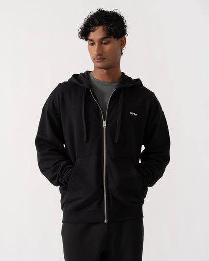 Man wearing  HUGO Dapozip Mens Cotton-terry zip-up hoodie with logo print - Black 001 with pockets