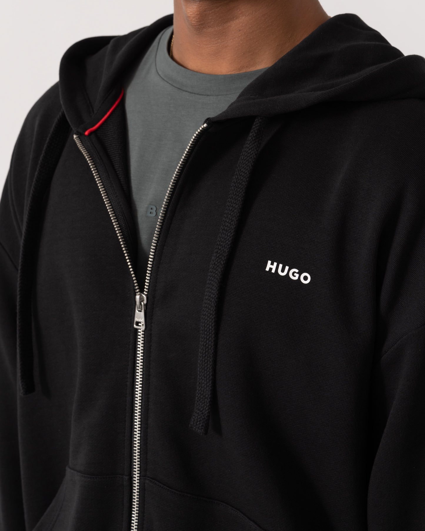 Close up of HUGO Dapozip Mens Cotton-terry zip-up hoodie with logo print - Black 001