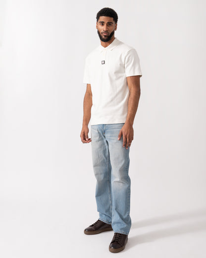 full length of a model wearing a HUGO Deabono Mens Interlock Cotton Polo Shirt with Stacked Logo in Natural white