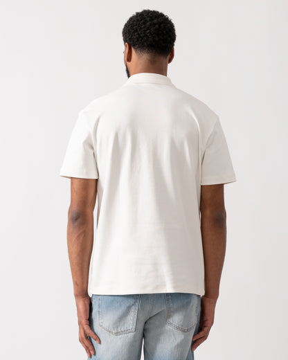 back of a model wearing a HUGO Deabono Mens Interlock Cotton Polo Shirt with Stacked Logo in Natural white