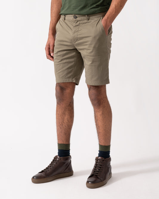 model wearing BOSS Orange Mens Slim Fit Chino Shorts in Stretch Cotton Twill, Open Green