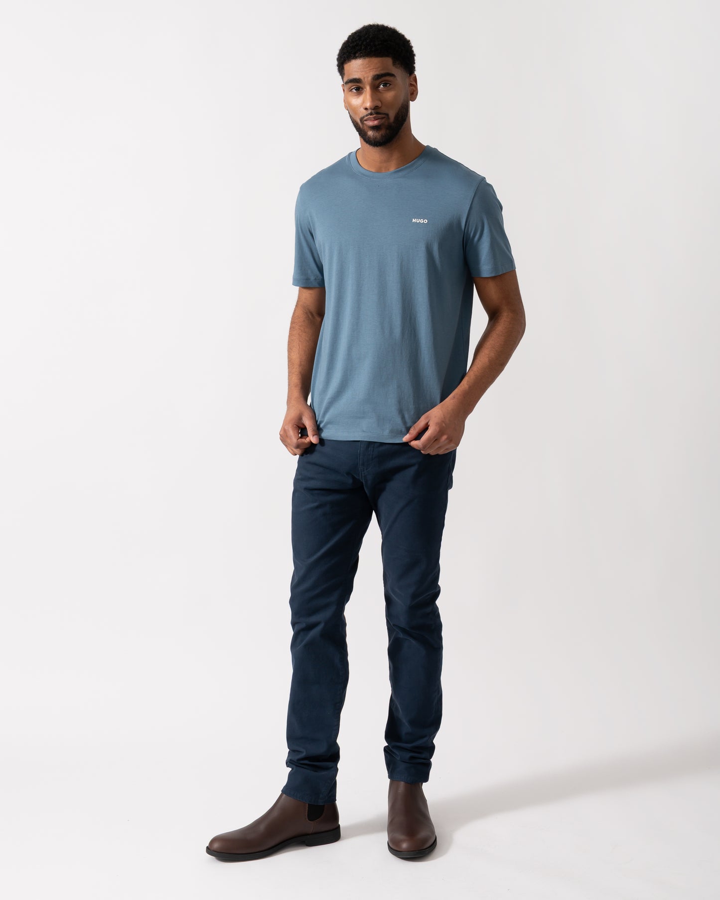 Full length shot of a Model wearing a HUGO Dero222 Mens Cotton-Jersey T-Shirt with Logo Print in Open Blue
