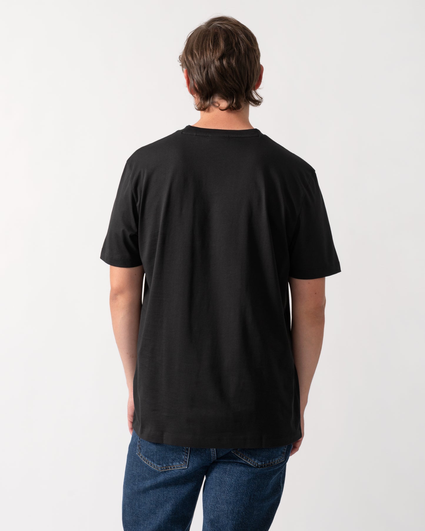 back of model wearing a HUGO Diflow Mens T-Shirt in Black 001