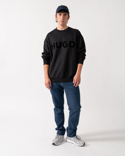 full length shot of a model wearing a HUGO Dinex Mens Oversized-Fit Sweatshirt in Cotton Terry with Tonal Logo in Black 001