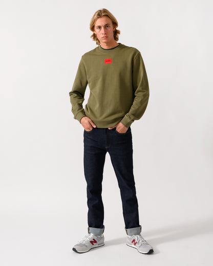 full length of a model wearing a HUGO Diragol212 Label Logo Mens Sweatshirt in Open Green 389