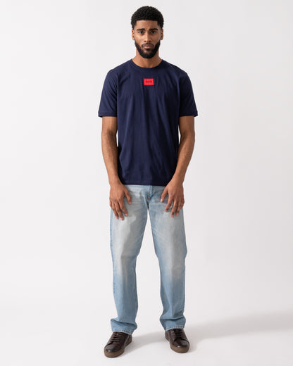 full length of a model wearing a HUGO Diragolino212 Label Logo Mens T-Shirt in Navy