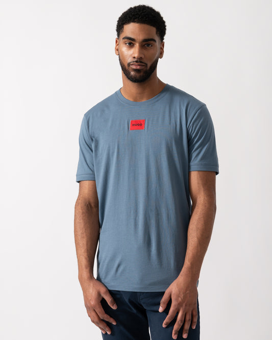 Model wearing a HUGO Diragolino212 Label Logo Mens T-Shirt in Open Blue